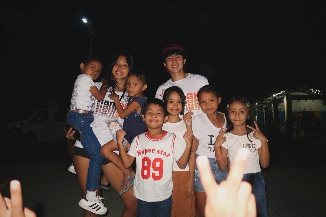 Club members with children in the community